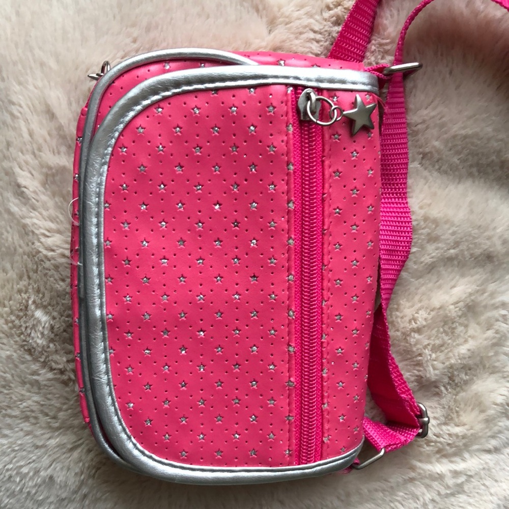 The color Neon pink, it’s a cute and pretty purse! And a lot of Useful pockets.